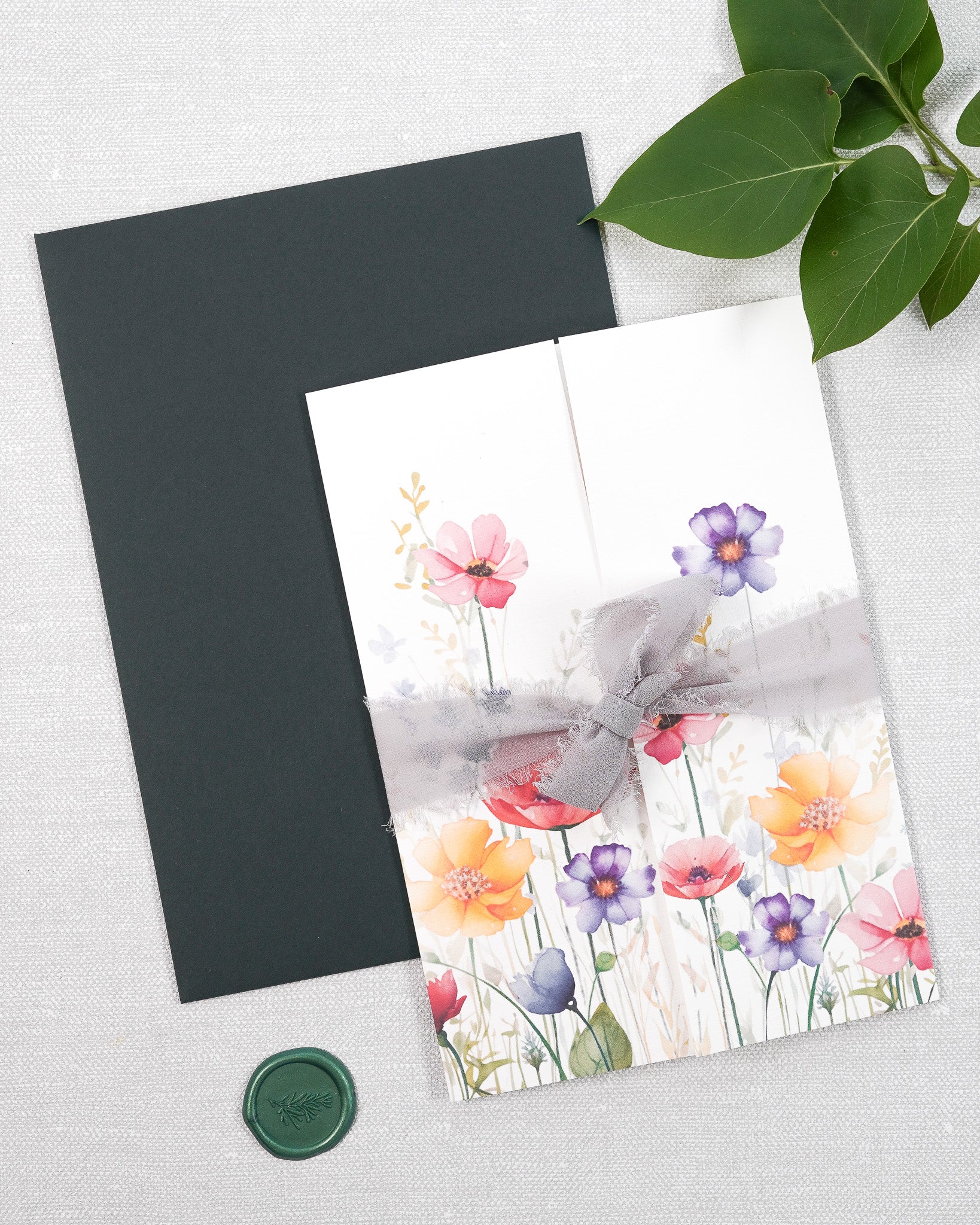 Handmade gatefold wedding stationery. In a garden print