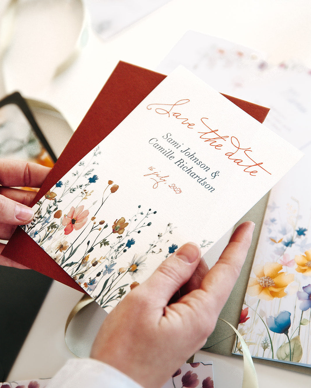 A handmade wedding Save The Date Card with flowers. Printed on a high end luxury paper