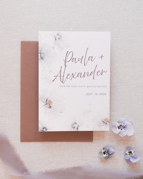 A save the date card in a grey floral print. Matched with a grey envelope