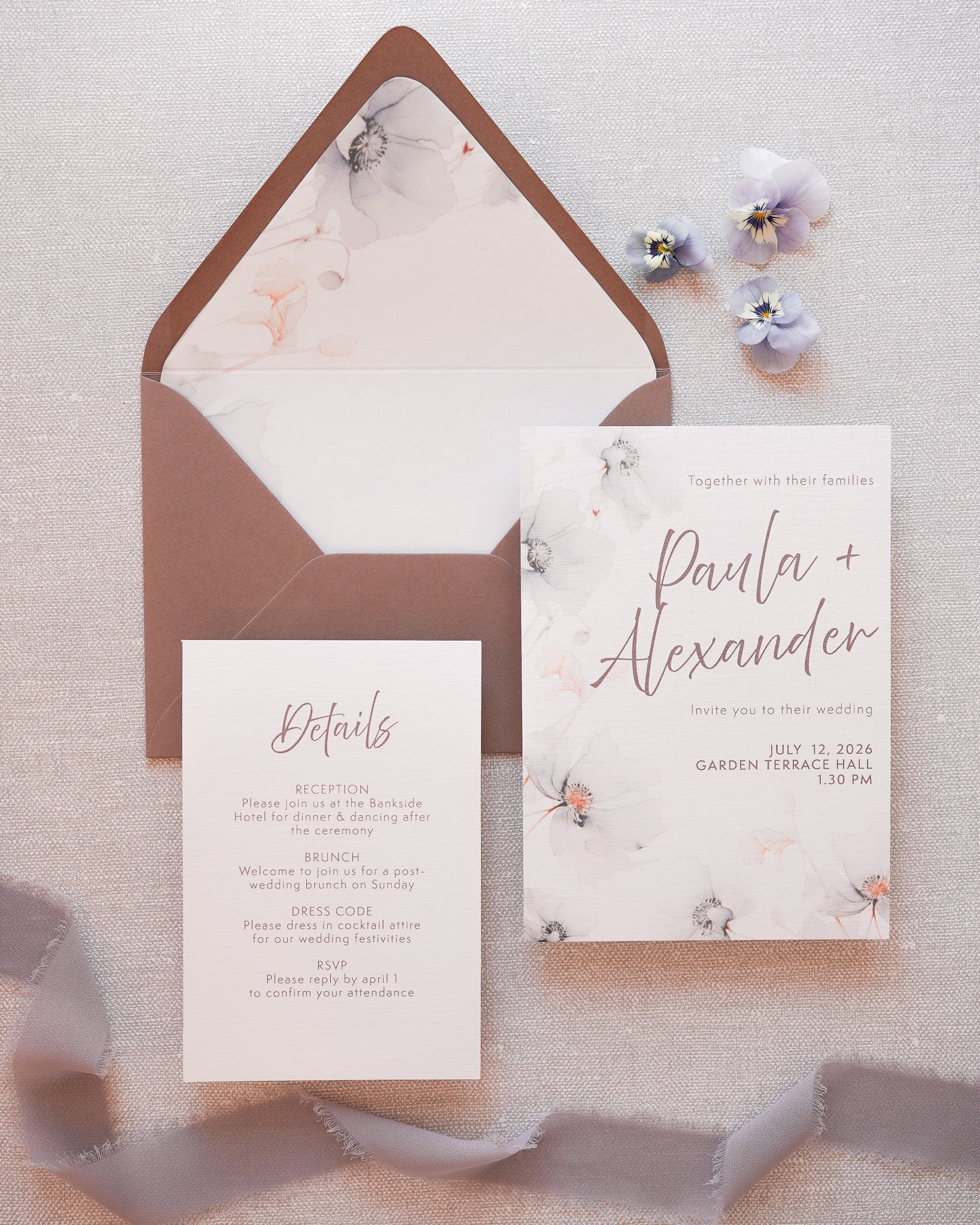 A modern wedding invitation with soft grey florals. A main card and a detail card