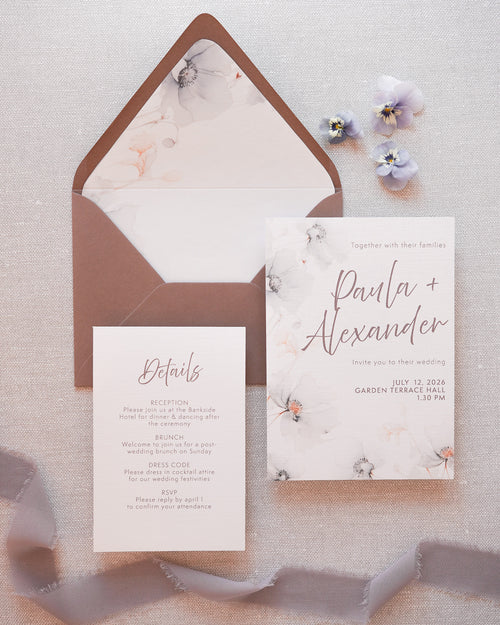 A modern wedding invitation with soft grey florals. A main card and a detail card