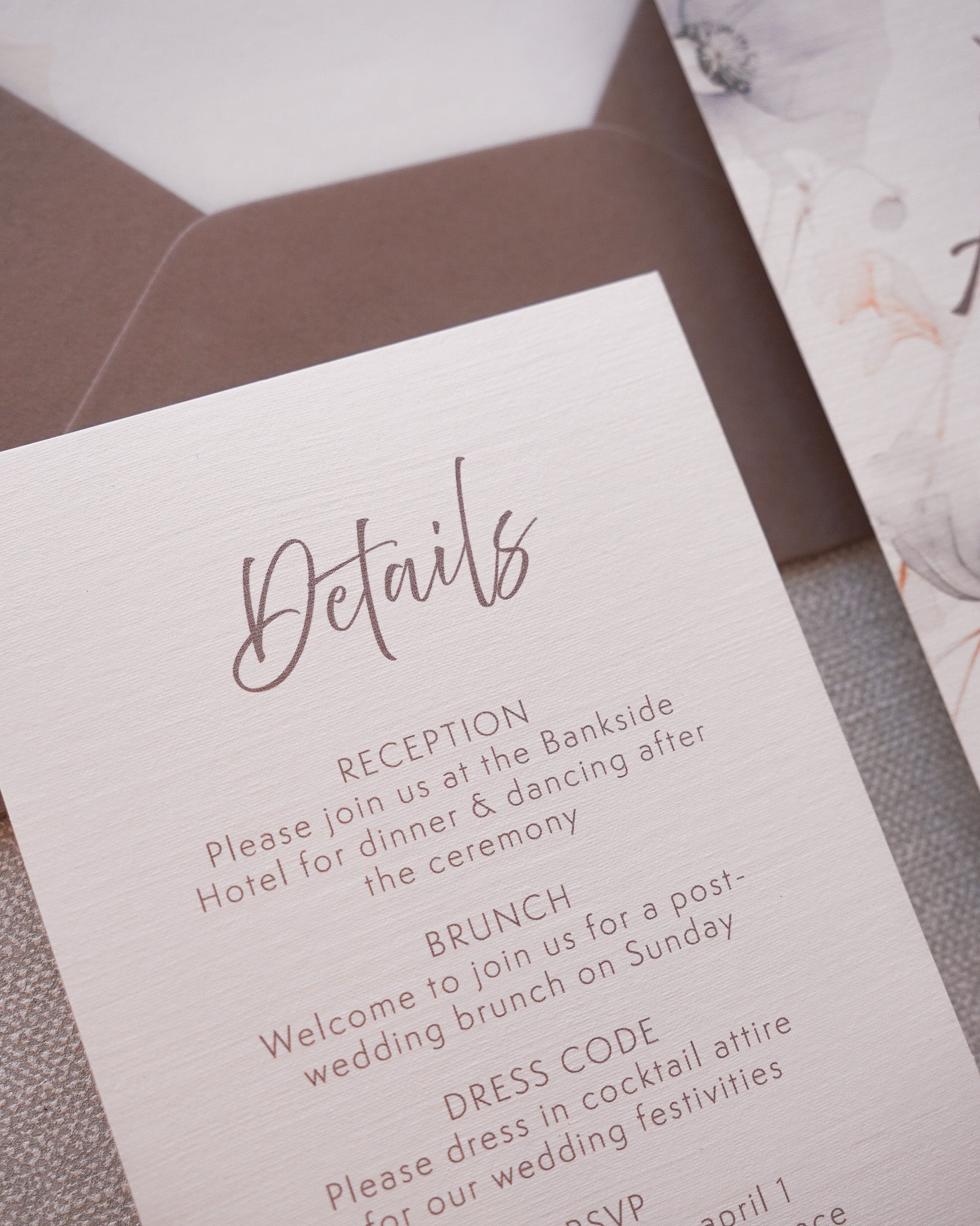 A close up on a wedding invitation detail card